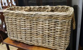 A three section wicker log basket W.107cm