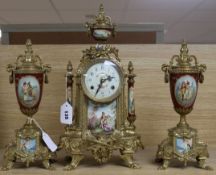 A 20th century porcelain and gilt metal clock garniture, the clock having urn-shaped top with pine