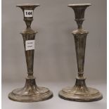 A pair of plated candlesticks height 31.5cm
