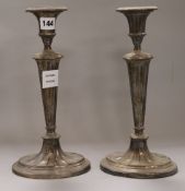 A pair of plated candlesticks height 31.5cm