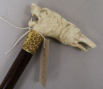A late Victorian gold plated mounted carved ivory double dogs head handle walking stick length 88cm