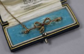 An Edwardian 15ct gold, yellow metal, gem set and seed pearl ribbon bow bar brooch (adapted?),