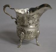 An Edwardian embossed silver cream jug, Williams Ltd, Birmingham, 1904, height 95mm.