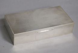 A George VI engine turned silver rectangular cigarette box, John Rose, Birmingham, 1946, 17.2cm.