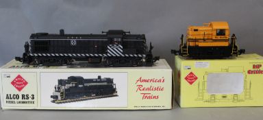 An Aristocraft G gauge Alco RS-3 diesel locomotive and a Lil' Critter Rio Grande diesel locomotive