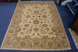 A cream ground rug 235 x 170cm