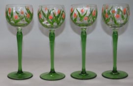 A set of four Art Nouveau green and pink enamelled hock glasses height 20cm