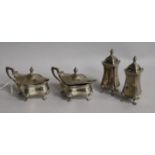 A George V silver four piece condiment set by Walker & Hall, Birmingham, 1921 and three associated