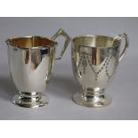 Two early 20th century silver christening mugs, one with engraved decoration, 7 oz.