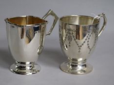 Two early 20th century silver christening mugs, one with engraved decoration, 7 oz.