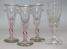 Three Dutch 18th century style knopped pink and white opaque twist wine glasses and a late