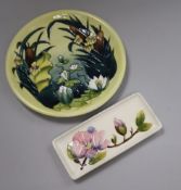 A Moorcroft Lamia pattern circular plate, boxed and a small rectangular Magnolia pattern dish