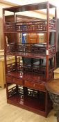 A Chinese hardwood open bookcase W.97cm