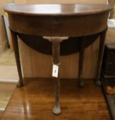 A demi lune side table W.76cm