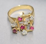 A gold, diamond and ruby dress ring, size Q