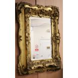 A late Victorian carved gilt wood ''picture'' framed mirror W.71cm