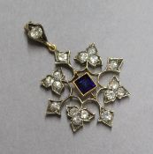 A sapphire and diamond openwork yellow metal pendant, overall 36mm.