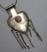 An Ethiopian white metal heart shaped pendant, inset with a carnelian 4in.