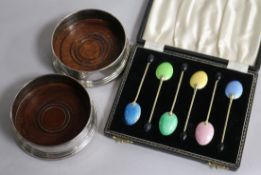 A cased set of six silver and enamel bean end coffee spoons and a pair of modern silver mounted wine