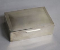 A George VI engine turned silver rectangular cigarette box, W.H. Manton Ltd, Birmingham, 1950,