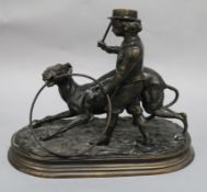 After J Moignez. A bronze of a boy and a greyhound, height 25cm