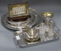 A quantity of plated wares including a desk calendar largest diameter 40cm