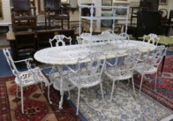 A large painted garden table with eight elbow chairs and a drinks trolley W. of table 235cm