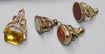 Four assorted 19th century gold plated and overlaid fob seals