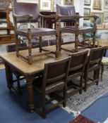 An oak dining table and eight chairs W.181cm