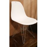 A modern chrome base chair