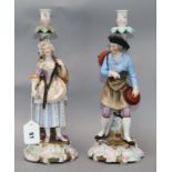 A pair of German porcelain figural candlesticks 36cm