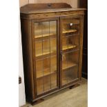 An Edwardian oak leaded bookcase W.94cm