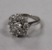 An 18ct white gold and diamond cluster ring (total diamond weight approx 1.0ct), size F.