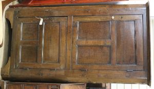 A two door oak corner cupboard W.107cm