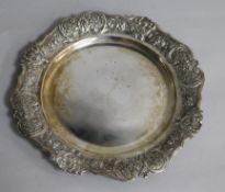 A Spanish silver plate with shell and rose border, inscribed: 'To Consul Frank A. Henry from the