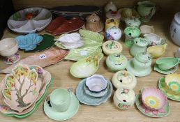 A collection of Carlton Ware floral and leaf moulded preserve jars and covers and dishes, some