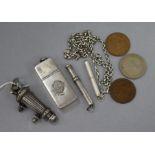 A rifleman's light infantry whistle, vesta, two silver pencils and three coins