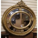A large oval gilt mirror W.125cm. approx.