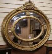 A large oval gilt mirror W.125cm. approx.