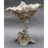 A floral and putti encrusted centrepiece height 35cm