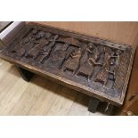A heavy carved coffee table W.122cm