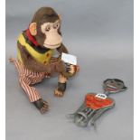 A 1930's novelty bottle opener and a mechanical monkey