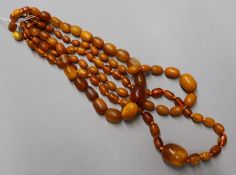 Three assorted amber bead necklaces, gross weight 88 grams.