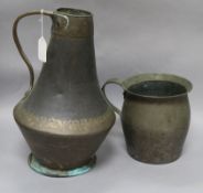 Two Middle Eastern copper jugs tallest 36cm