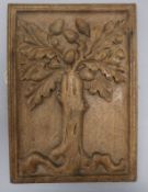 An early 18th century oak panel, carved with an oak tree and acorns 33 x 24cm