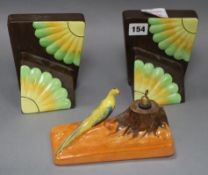 A pair of Carlton Ware Art Deco bookends pattern 3535 and a bird pen stand