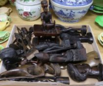 A quantity of small Makonde carved tribal busts and figural carvings