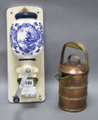 A Delft wall mounted coffee grinder and a copper and brass covered jug longest 34cm