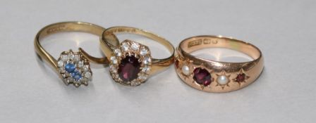 Three assorted 9ct gold and gem set dress rings, including garnet, gross 8.2 grams.