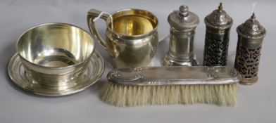 A sterling silver three-piece Christening set, inscribed, a silver-backed clothes brush and three